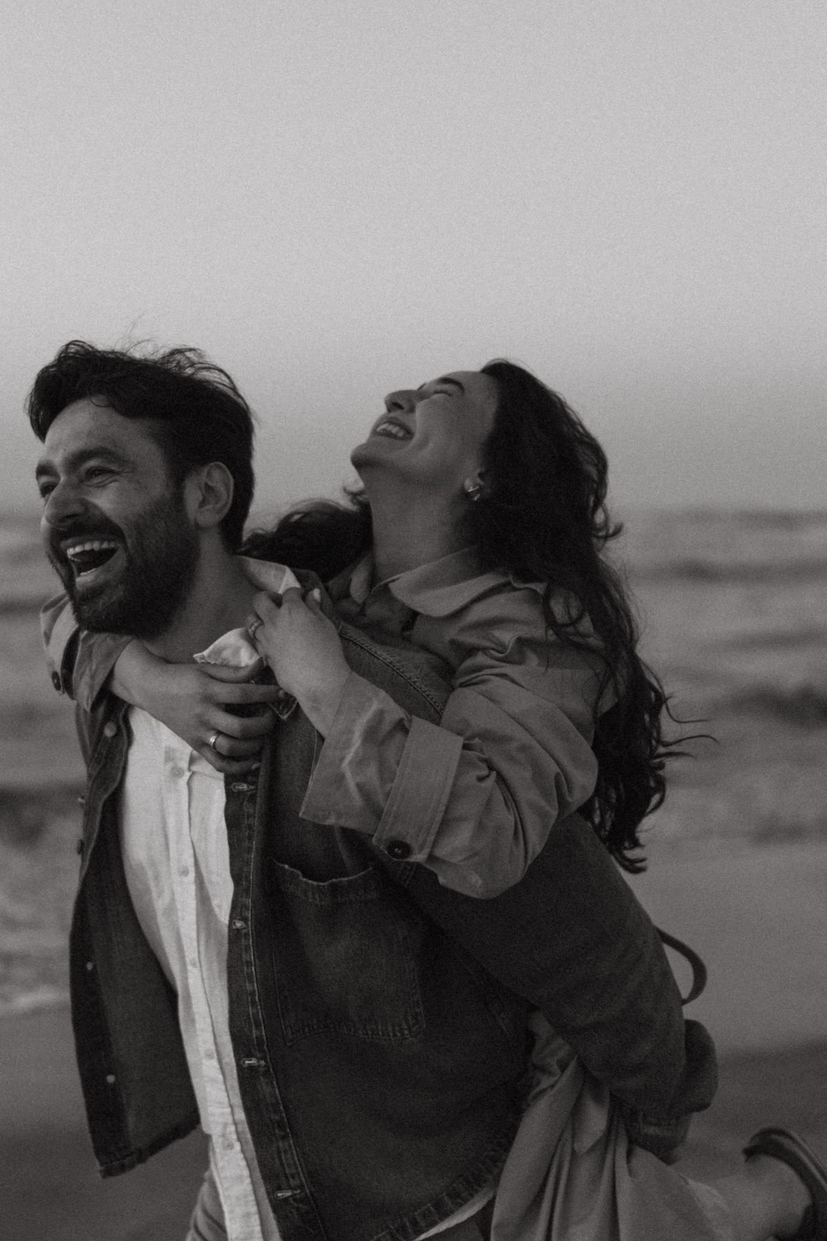 Couple laughing on the beach