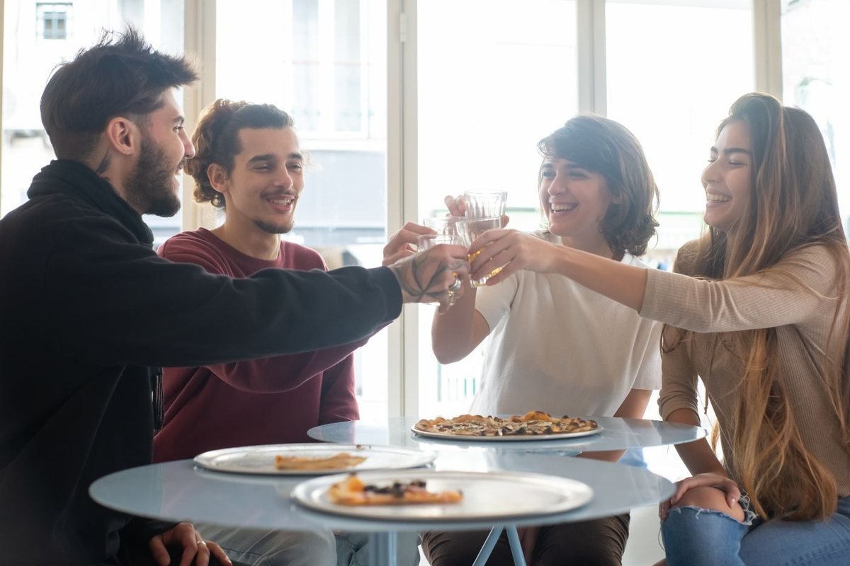 Friends raising a toast around a table